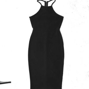 formfitting black dress with revealing back